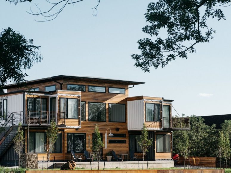 This home is built of shipping containers by its owner for this family, it's clad with wood and metal for a cool rustic look