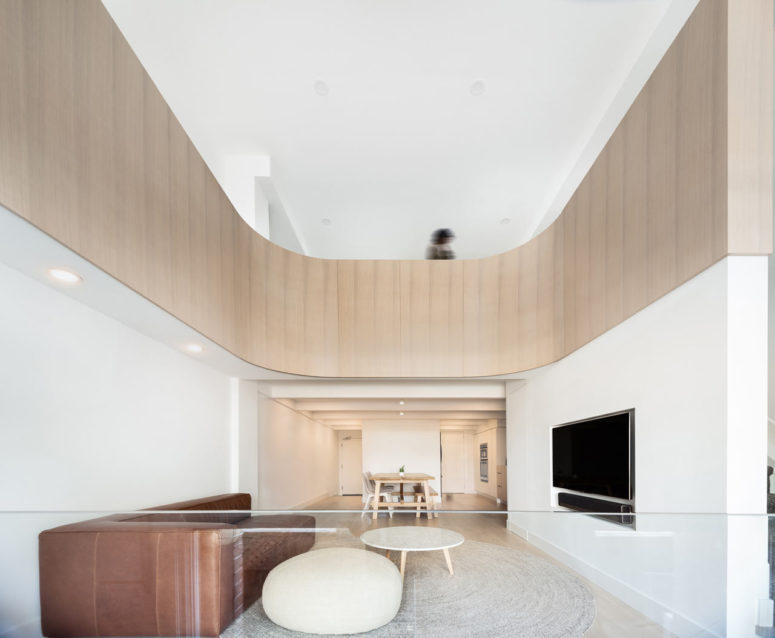 This loft was born from an old church, and it features a gorgeous wooden curve, which is a unique feature