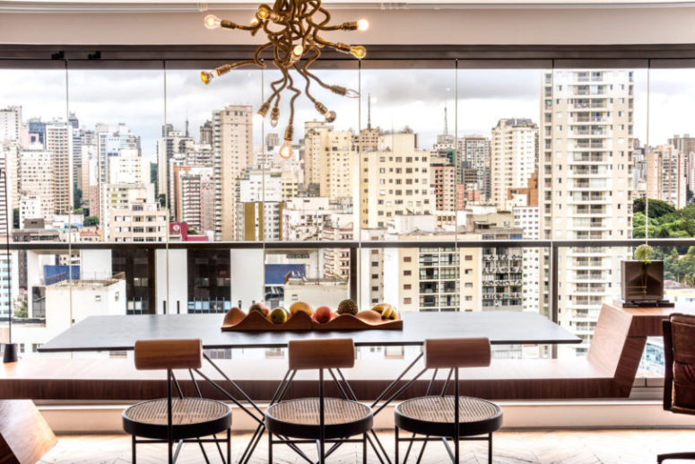 The dining space is located by a glazed wall to enjoy the views as much as possible