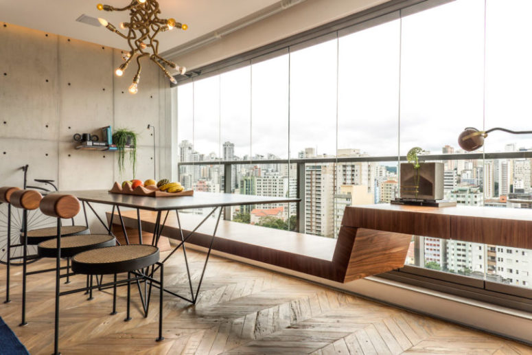 The bench used for dining is continued and becomes a custom made desk