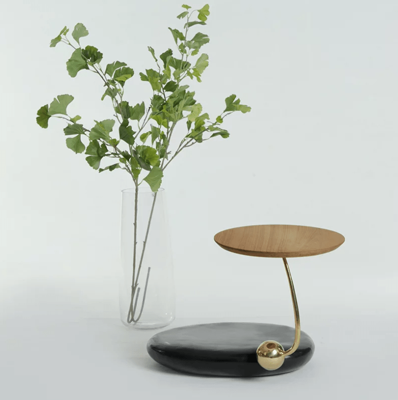 stylish side table design This chic table is also included in the collection, it's composed of stone and wood