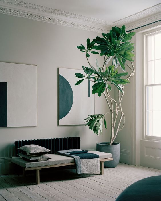 a living room done in greys and off-whites plus some black touches that don't contrast too much