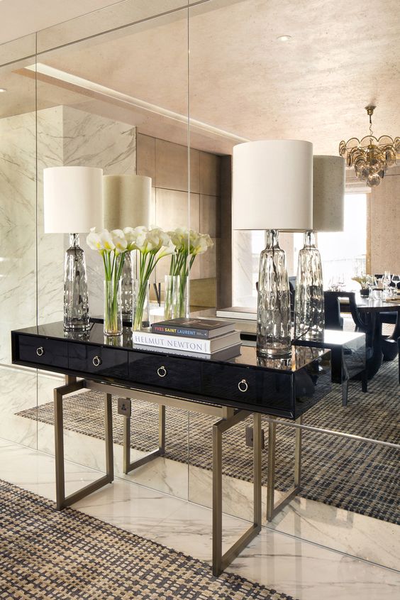 a mirror wall is ideal for an art-deco space, it brings light, elegance and a touch of exqquisiteness