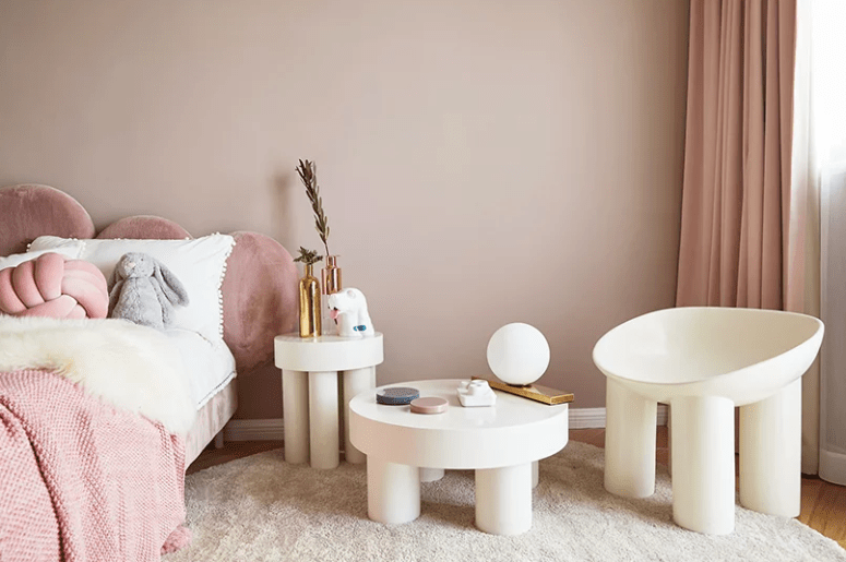 kids room design in neutral colors The kid's room is done in neutrals and tender pink tones, gilded touches add a glam feel