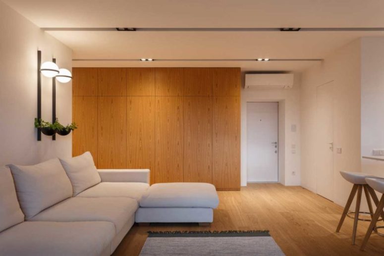 The storage is hidden behind the doors to make the space uncluttered and sleek