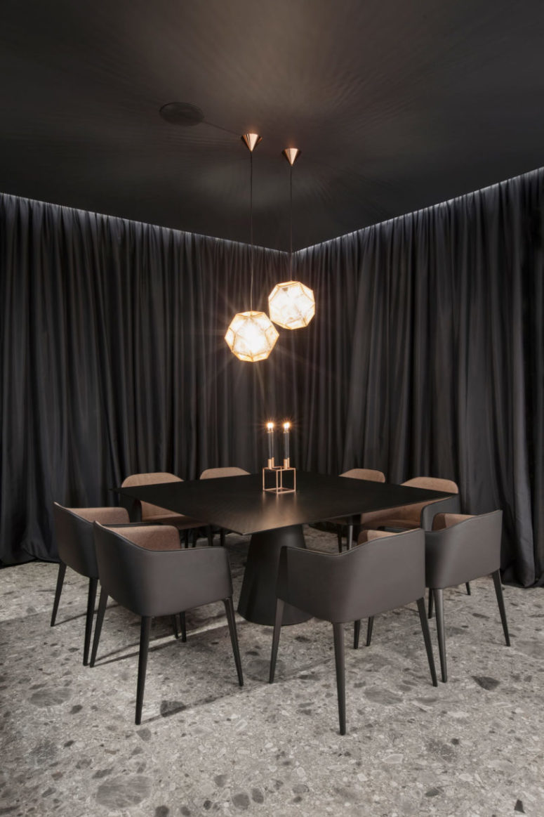 The dining space is done with a square metal table and comfortable modern chairs with upholstery, look at the gorgeous faceted lamps over them The dining space is done with a square metal table and comfortable modern chairs with upholstery, look at the gorgeous faceted lamps over them