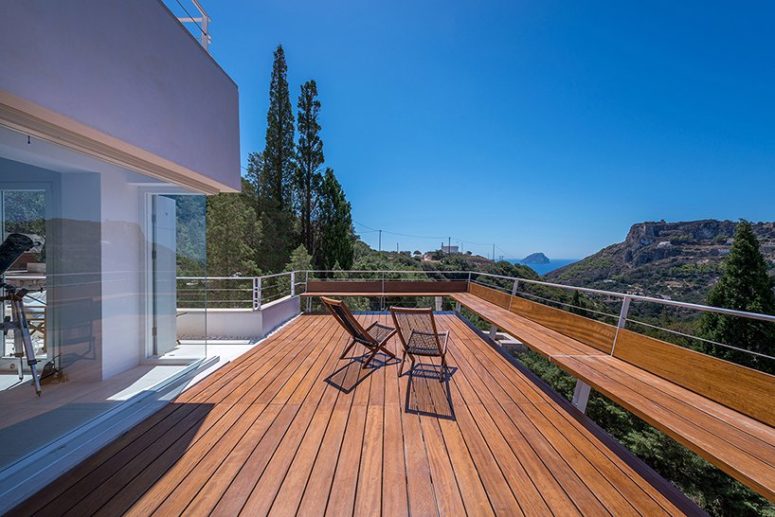 The main terrace features a bench along it and overlooks Kapsali Bay and Kythera Castle