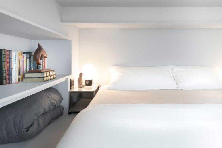 The bedroom isn't large, it's minimal and comfy for sleeping, there's open storage