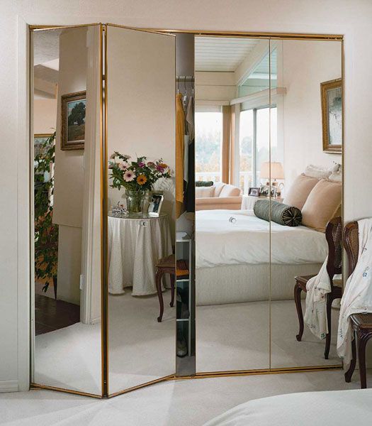 a seamless mirror closet with folding doors is a gorgeous option for many spaces, from vintage to modern glam ones