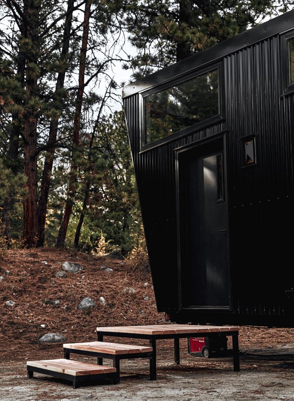 Externally, the structure takes on an angular form punctuated by irregularly proportioned windows