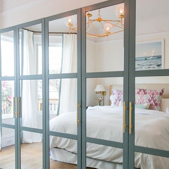 IKEA Pax wardrobe hacked with mirror doors and brass handles is a cool idea for a modern bedroom