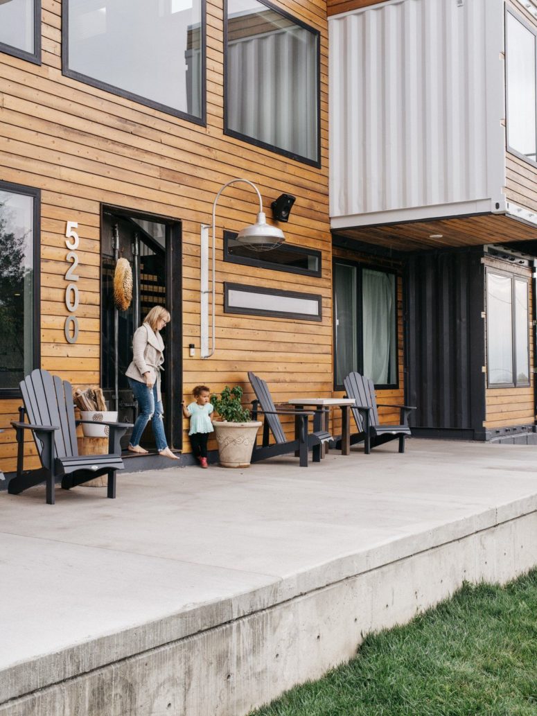 The outside deck is a concrete one, which makes it super durable, and there are some vintage wooden chairs