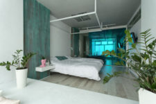 10 The sliding door is made of emerald glass to match the apartment color scheme