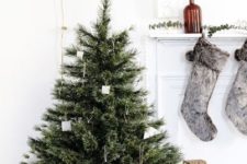10 a modern Nordic Christmas tree with simple cardboard ornaments and metal wire ornaments