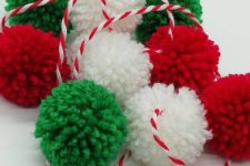 10 a pompom garland in traditional Christmas color and with a striped string will be a budget-savvy and fun decoration