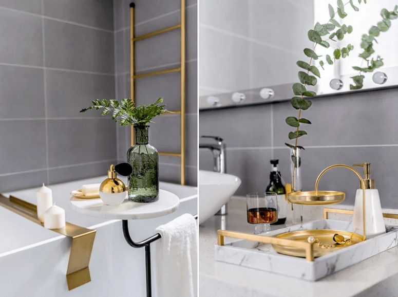 The bathroom is done with gilded touches and marble to make it refined and chic