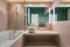 11 The master bathroom is done in blush and white, wiht a single emerald wall