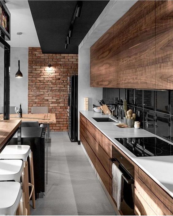 a cozy modern kitchen with rustic details and touches incorporated there, and an industrial brick wall