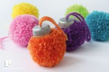 13 colorful Christmas ornaments made of pompoms and tin tops will add a lot of fun to your tree