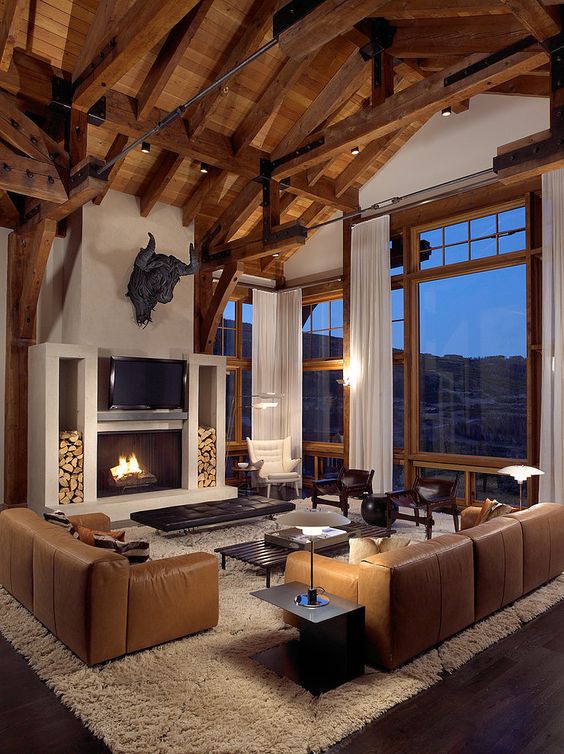 exposed wooden beams highlight the gabled roof and make it ideal for a modern rustic space