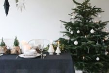 14 a modern Scandi Christmas tree with white ornaments – stars, snowflakes and balls and some lights