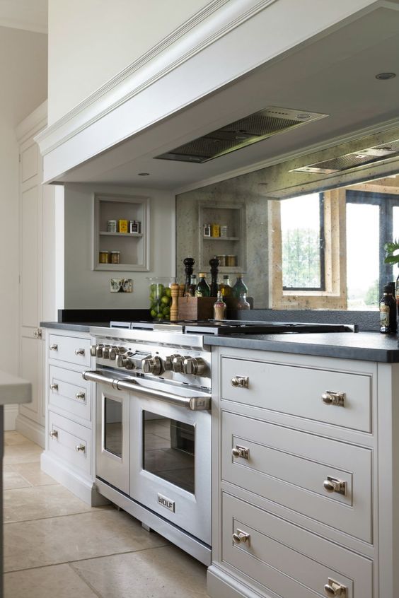 mirror backsplashes are making a huge comeback, they will easily fit any cabinet color and style