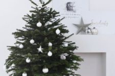 16 a small tree in a basket styled with white ornaments screams Scandinavian or minimalist