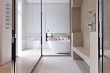 16 stone, tiles and glass create a chic and catchy yet neutral and contemporary bathroom