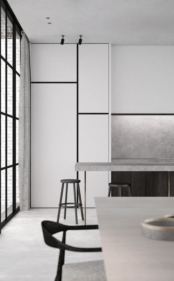 a minimalist kitchen with white cabinets and touches of concrete here and there to make it functional and catchy