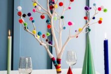 25 an alternative to a usual Christmas tree, whitewashed branches with colorful washi tape and pompoms