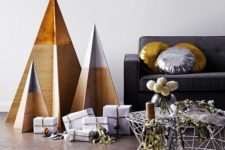 25 minimalist Christmas trees of plywood with dipped tops are all you need for a laconic interior