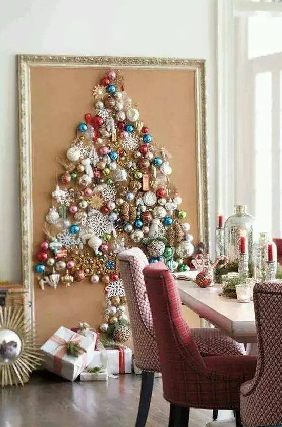 a large Christmas tree on canvas with a vintage frame is shaped only of colorful vintage ornaments for a chic look