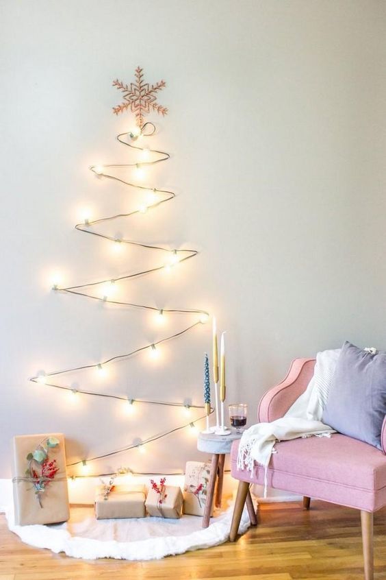 a simple and fast to make light Christmas tree with a snowflake topper looks great and catchy