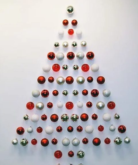 a simple and stylish red, gold and white Christmas ornament tree is a lovely idea for a small space or as alternative