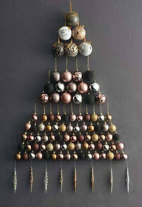a unique ornament Christmas tree in silver, gold, pink and black is a lovely idea if you don't have a tree itself