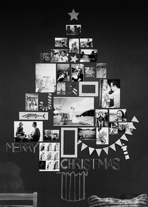 a wall-mounted black and white Christmas tree made of photos is a cool and cathcy decor idea