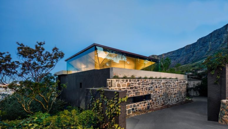 This contemporary family home features a unique pyramid roof and the upper floor, which is maximally exposed