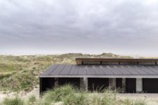 02 The outside of the house is done in black, while the interiors are done in neutrals