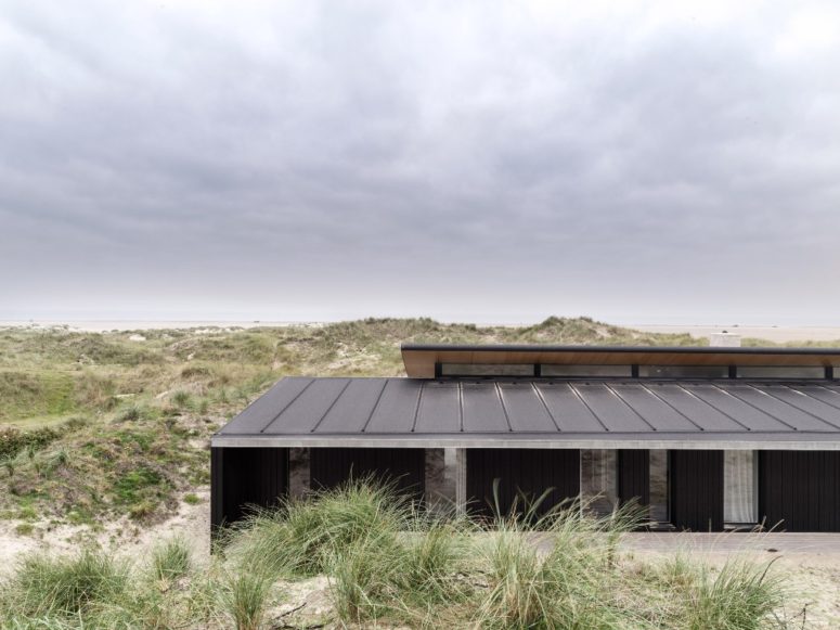 The outside of the house is done in black, while the interiors are done in neutrals