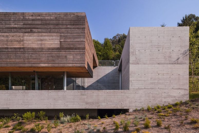There's a concrete base and frame that give the house a robust industrial look