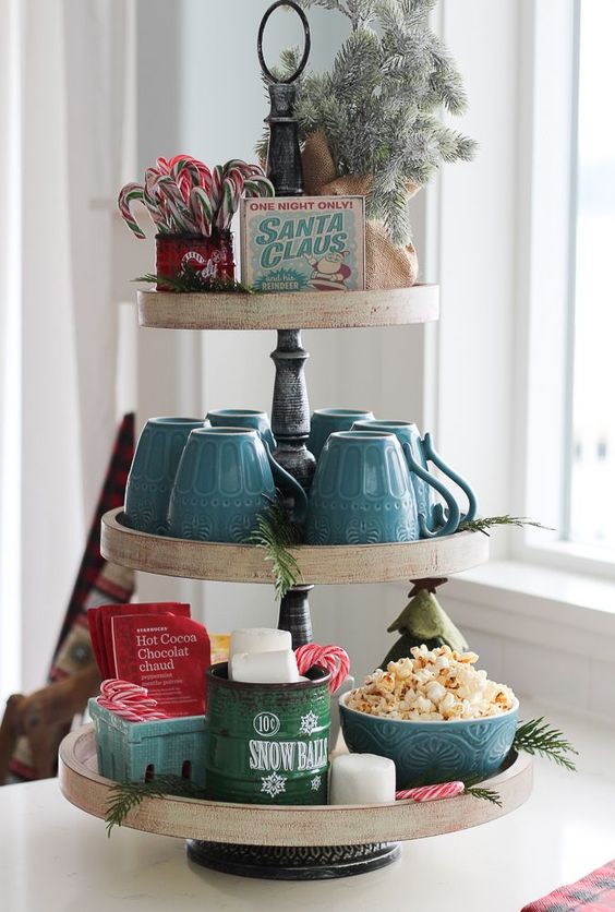a classic hot cocoa and sweets station organized using a cupcake stand is what you need for holidays