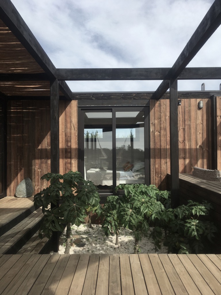 The deccks feature touches of nature like greenery and rocks to make the views of each room cooler