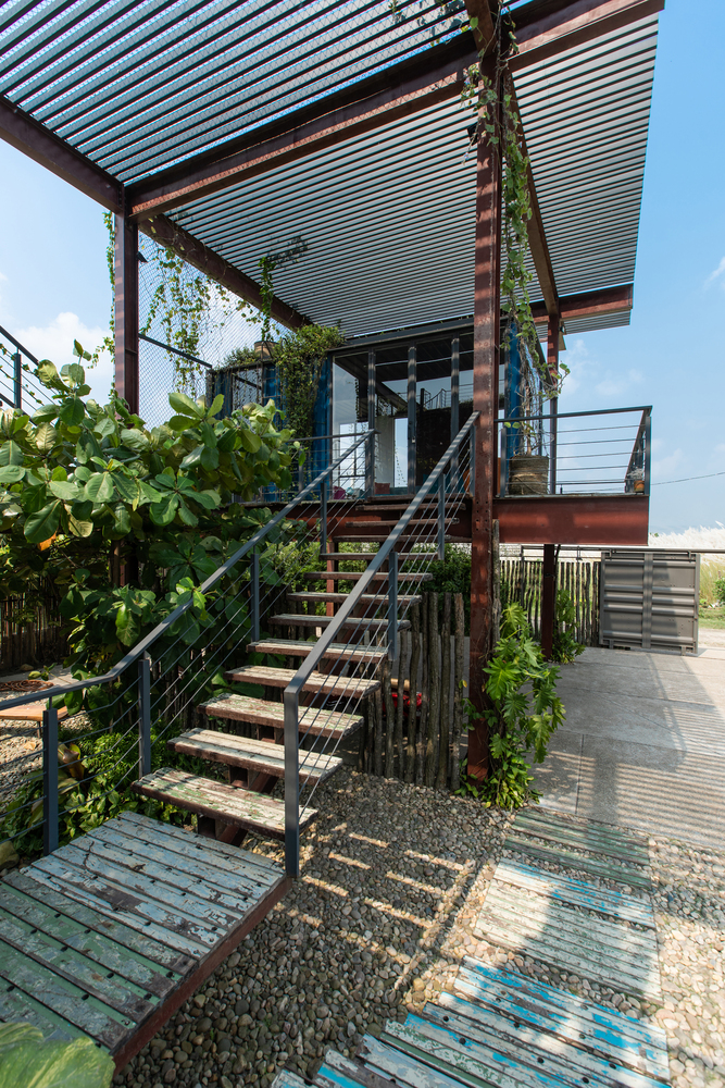 There are various decks and terraces connected with staircases throughout the house