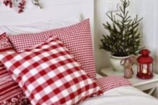 04 a bedroom in whites can be refreshed with holiday reds, berries, a lantern and even traditional bedding