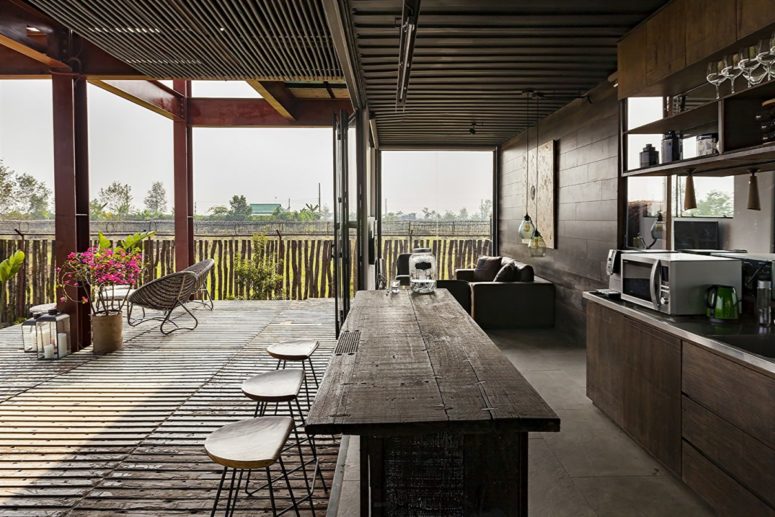 reclaimed wood is a great solution for any decor Reclaimed wood and metal were widely used throughout the residence, and all the spaces can be opened to outdoors