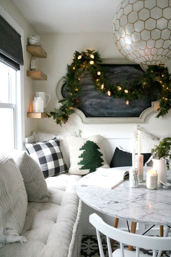 create a cozy dining nook in your kitchen instead of making a formal dining room where nobody will eat