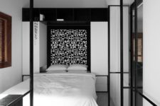 masculine-looking geometric headboard in b&w tones