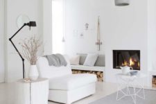 06 a minimalist Nrodic living room in white, off-whites and greys plus a cozy built-in fireplace