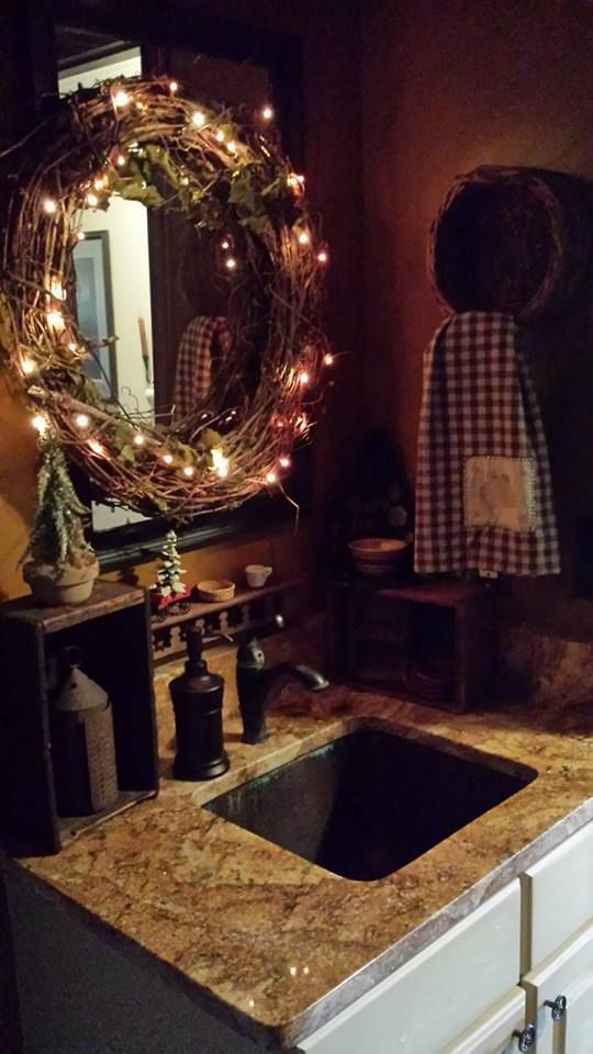cover a mirror with a Christmas wreath with lights to make your space more luminous and shiny