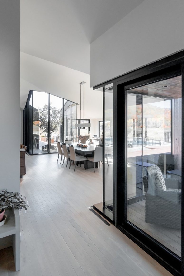 The dining space is done with simple minimalist furniture and a cool views of the terrace and nature around The dining space is done with simple minimalist furniture and a cool views of the terrace and nature around